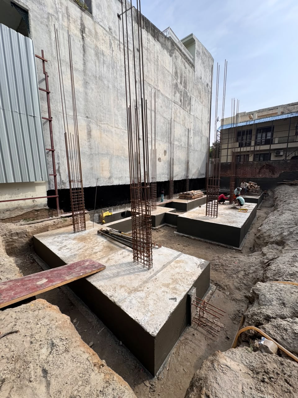 Plinth beam reinforcement over compacted earth at our Sector 44 Noida site