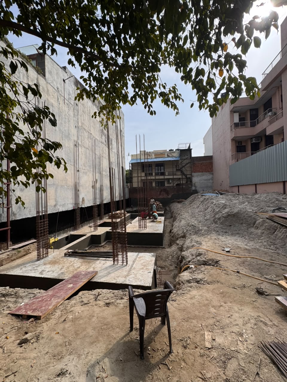 Full plot excavation with footing layout visible at our Sector 44 Noida site