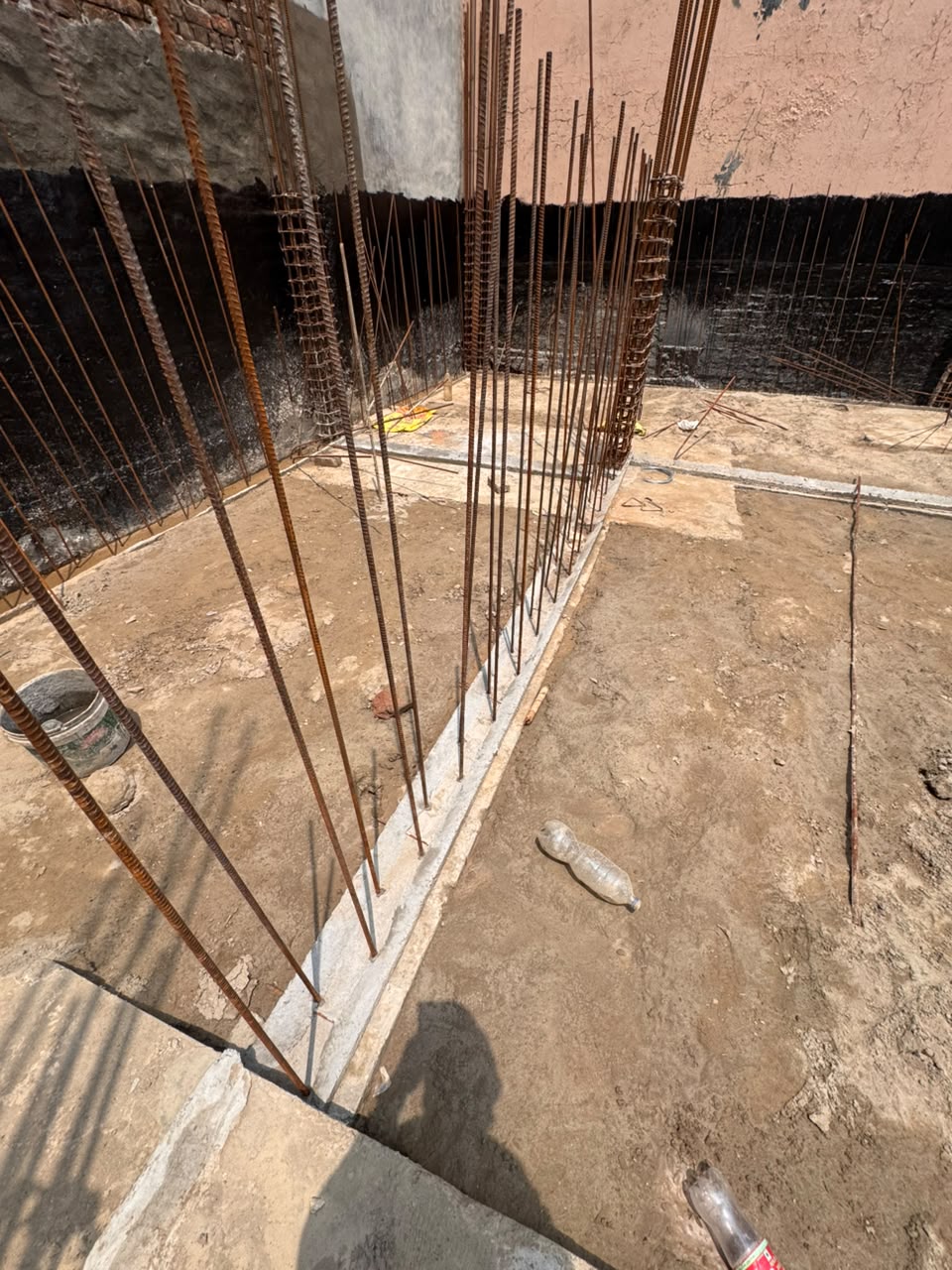 Column starter bars rising over cast footings at our Sector 44 Noida site