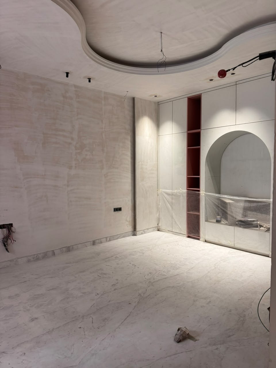 Built-in joinery and polished marble flooring in the dressing room of our Sector 41F Noida kothi